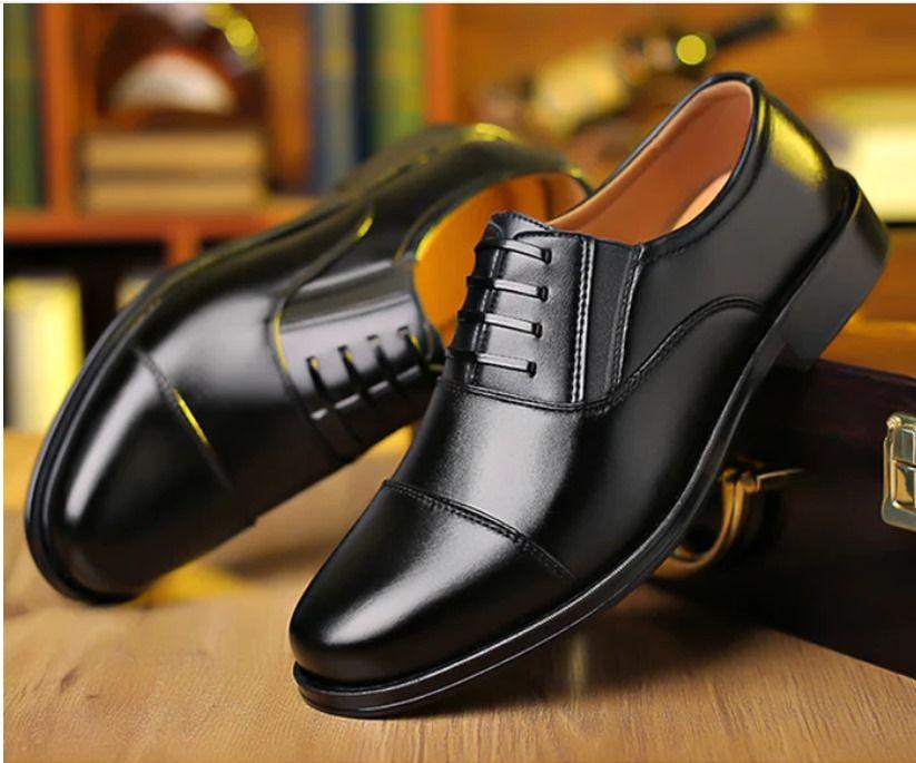Elegant black luxury men's formal shoes with classic lace-up design and polished finish