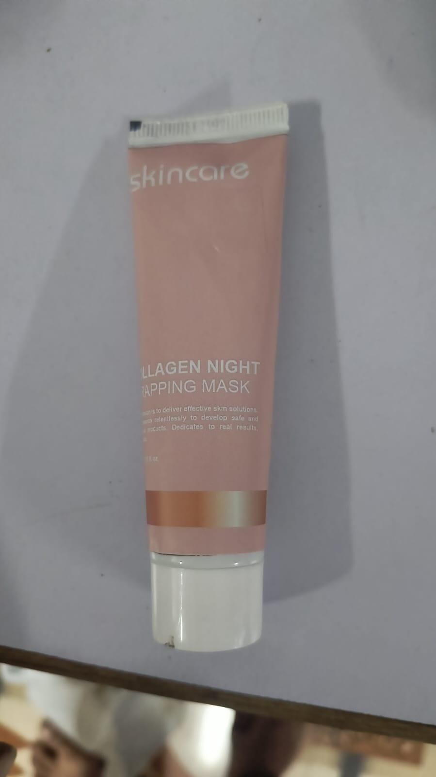 Fupei2-e5 Collagen Peel Off Mask in a pink tube for hydrating and rejuvenating skin