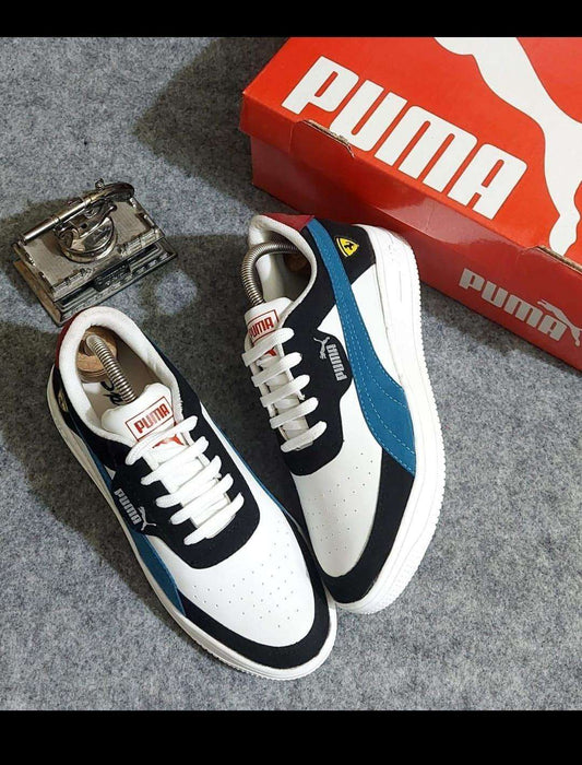 Stylish white and teal sneakers for men featuring a sleek design and comfortable fit, displayed with a vintage camera