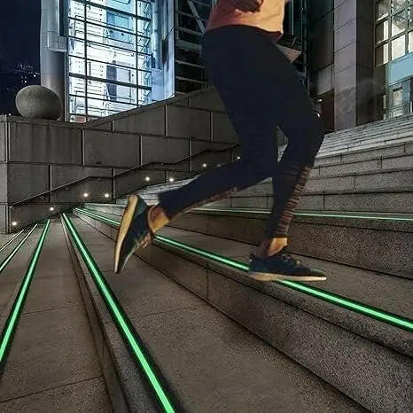 Anti slip glow tape on outdoor stairs for enhanced visibility and safety while walking at night