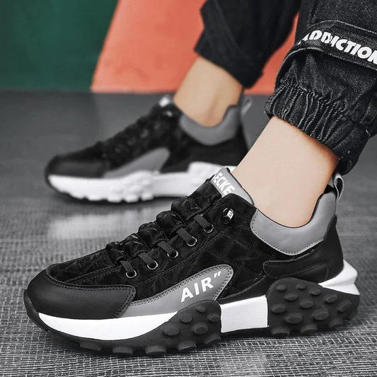 Stylish men's casual sneakers in black and gray with cushioned sole for comfort and support