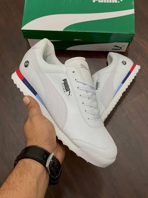 Puma white sneakers for men with a retro design and colorful sole accents