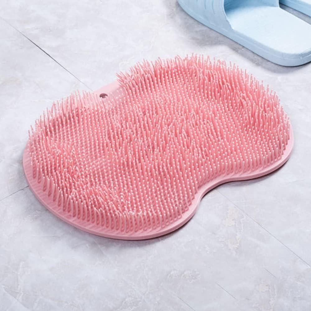 Soft pink silicone bath scrubber with textured bristles for gentle cleansing and exfoliation