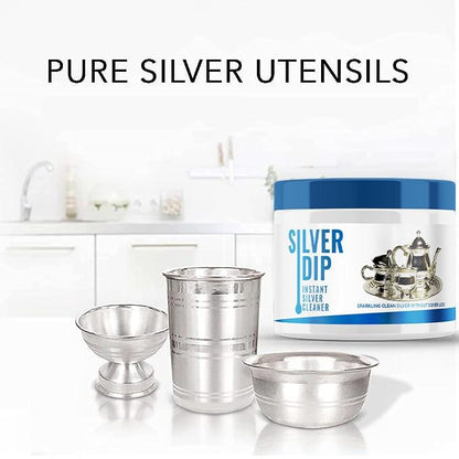Instant silver cleaner in a blue container with pure silver utensils for effective cleaning