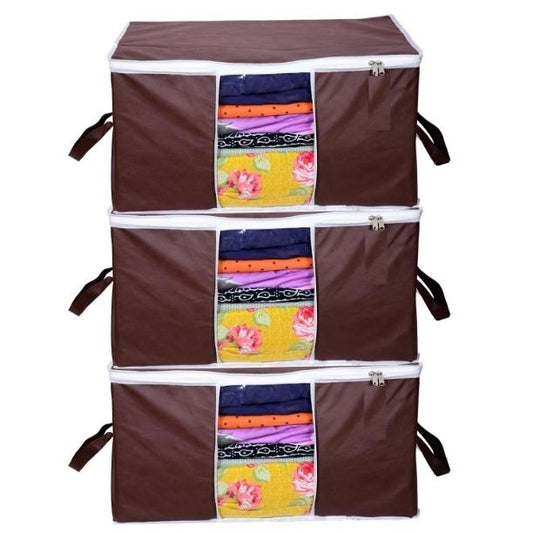 Stacked solid non woven storage organizers with colorful folded clothes visible through the front panel