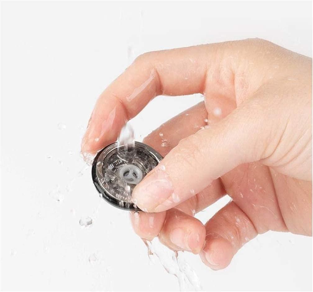 Hand washing the head of an electric shaving machine under running water for easy maintenance